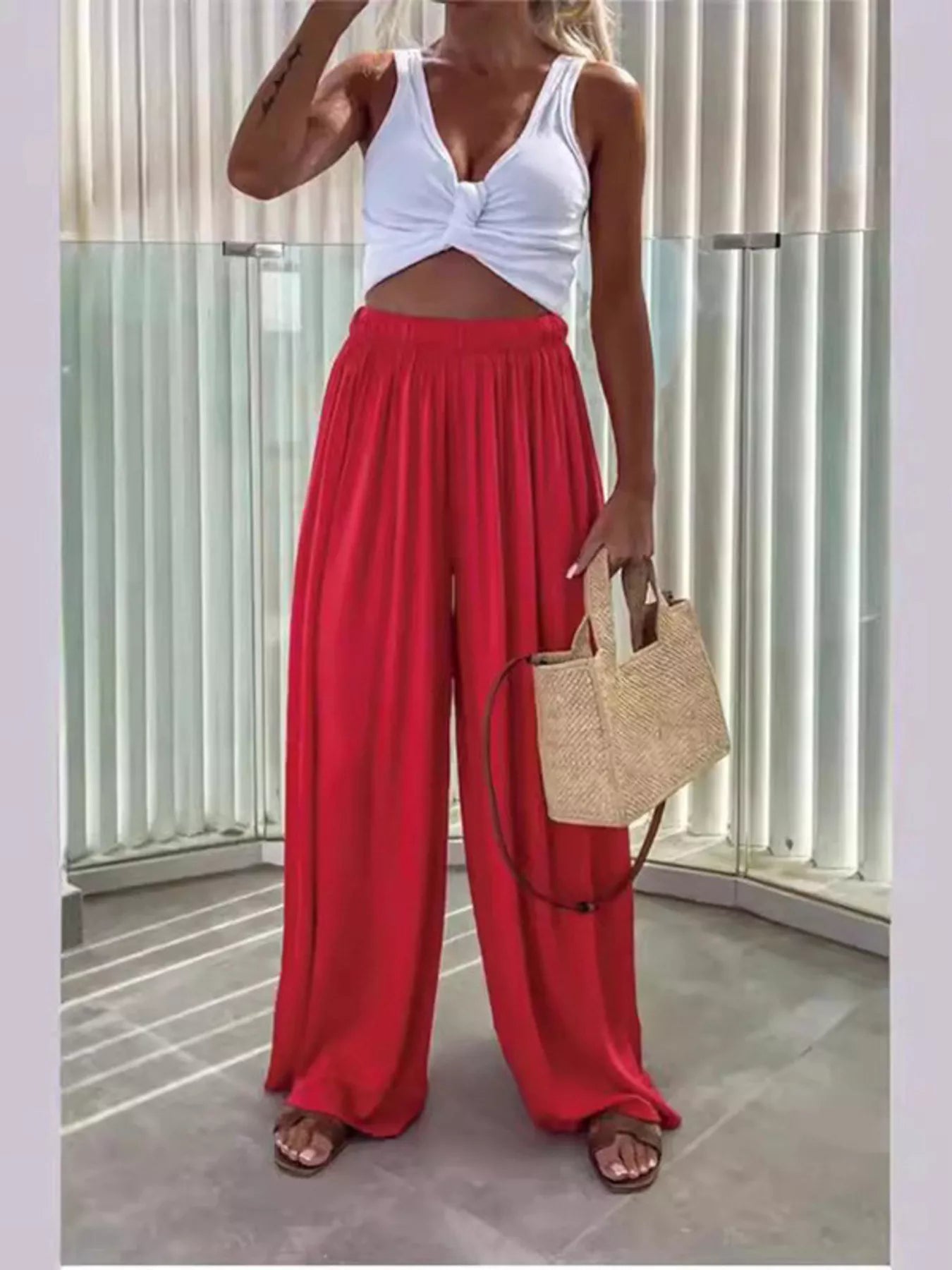 Flowy wide-leg pants from Trendsi, featuring a relaxed fit and lightweight fabric perfect for casual and stylish outfits.
