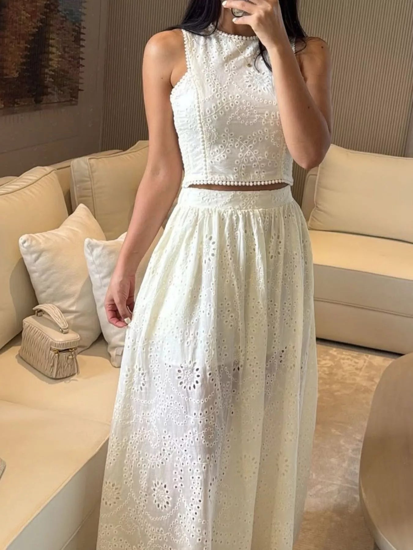 Trendsi eyelet crop top and maxi skirt set, featuring a stylish crop top and flowing skirt with eyelet details.