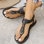 Women's ankle strap thong flat sandals by Trendsi, minimalist summer footwear with open toe design and slim ankle strap.