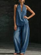 Plus size women's halter neck top and wide-leg pants two-piece set by Trendsi, featuring a stylish dress look with a modern fit.