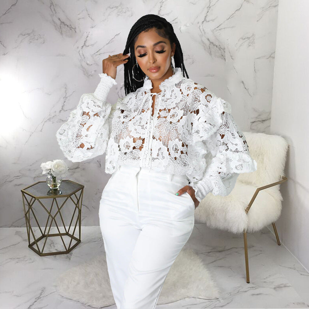 Women’s lace-up cardigan with lantern sleeves, hollow out cutouts, and flounce trim by Bella Mia.