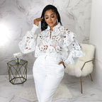Women’s lace-up cardigan with lantern sleeves, hollow out cutouts, and flounce trim by Bella Mia.