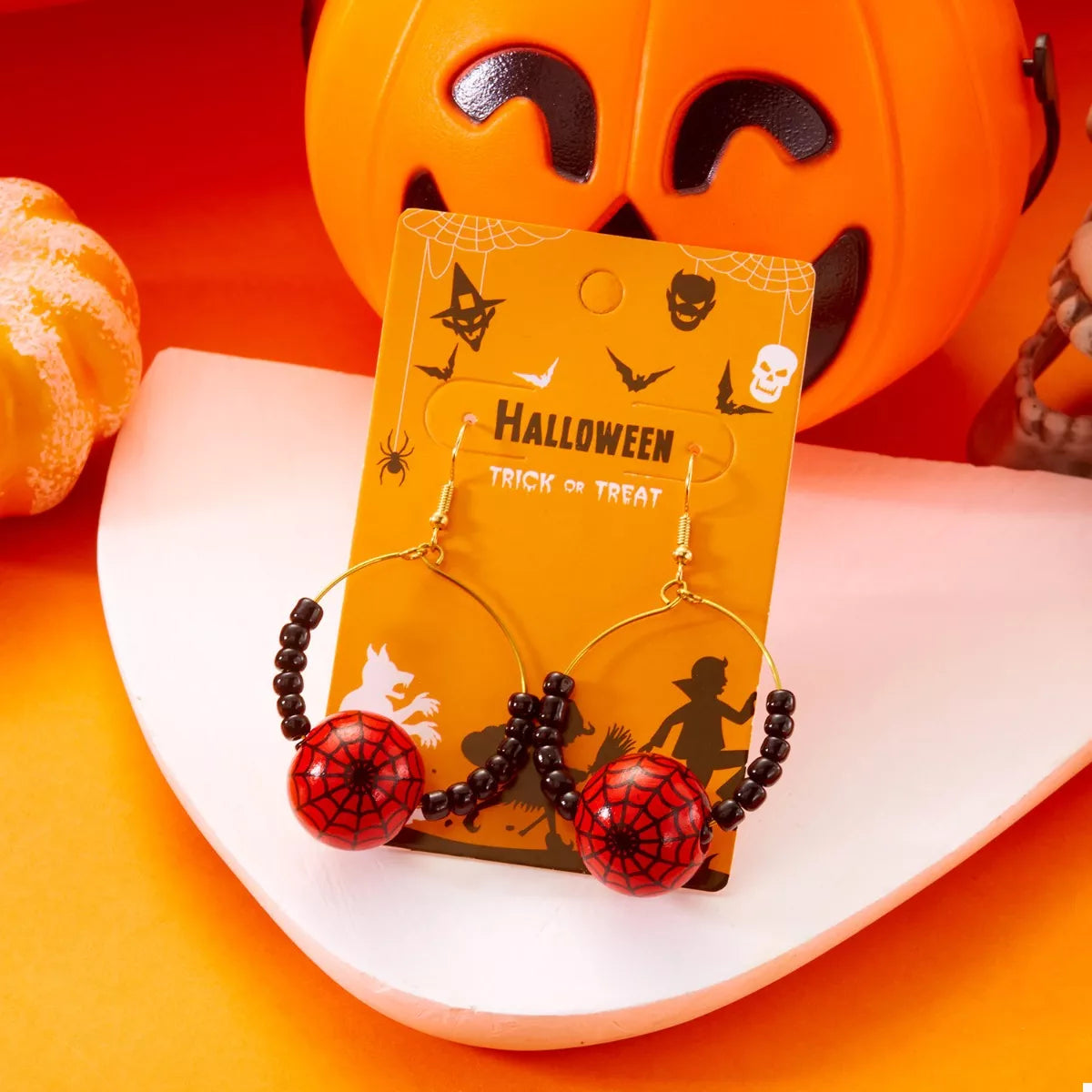 Gold-plated Halloween bead earrings featuring orange and black beads, stylish jewelry by Shopimist