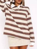 Striped long sleeve polo top with button details from Trendsi, featuring a classic design and comfortable fit.