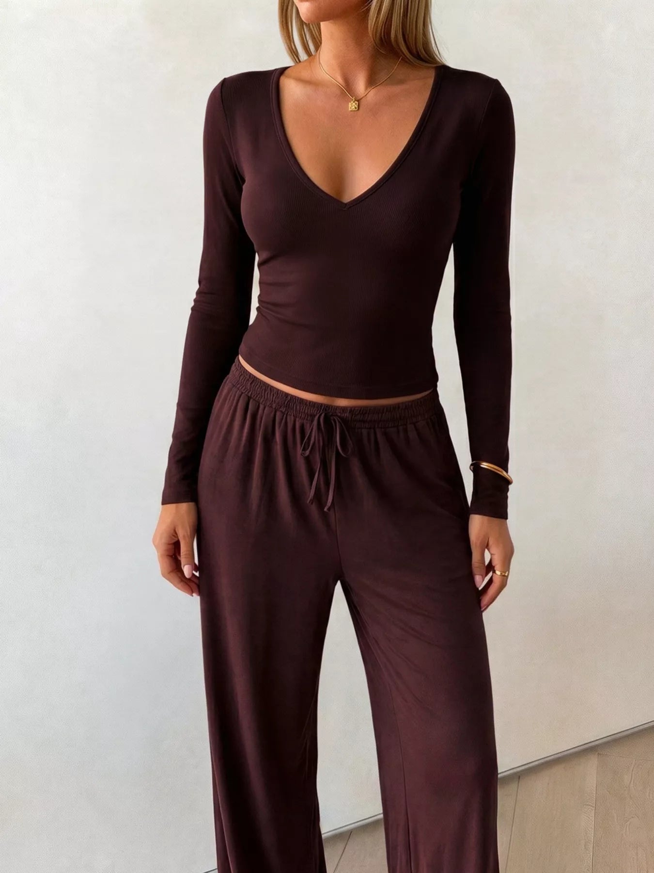 Plush Fashion Hub V-neck long sleeve top and wide-leg pants matching set, soft plush fabric, comfortable lounge wear ensemble.
