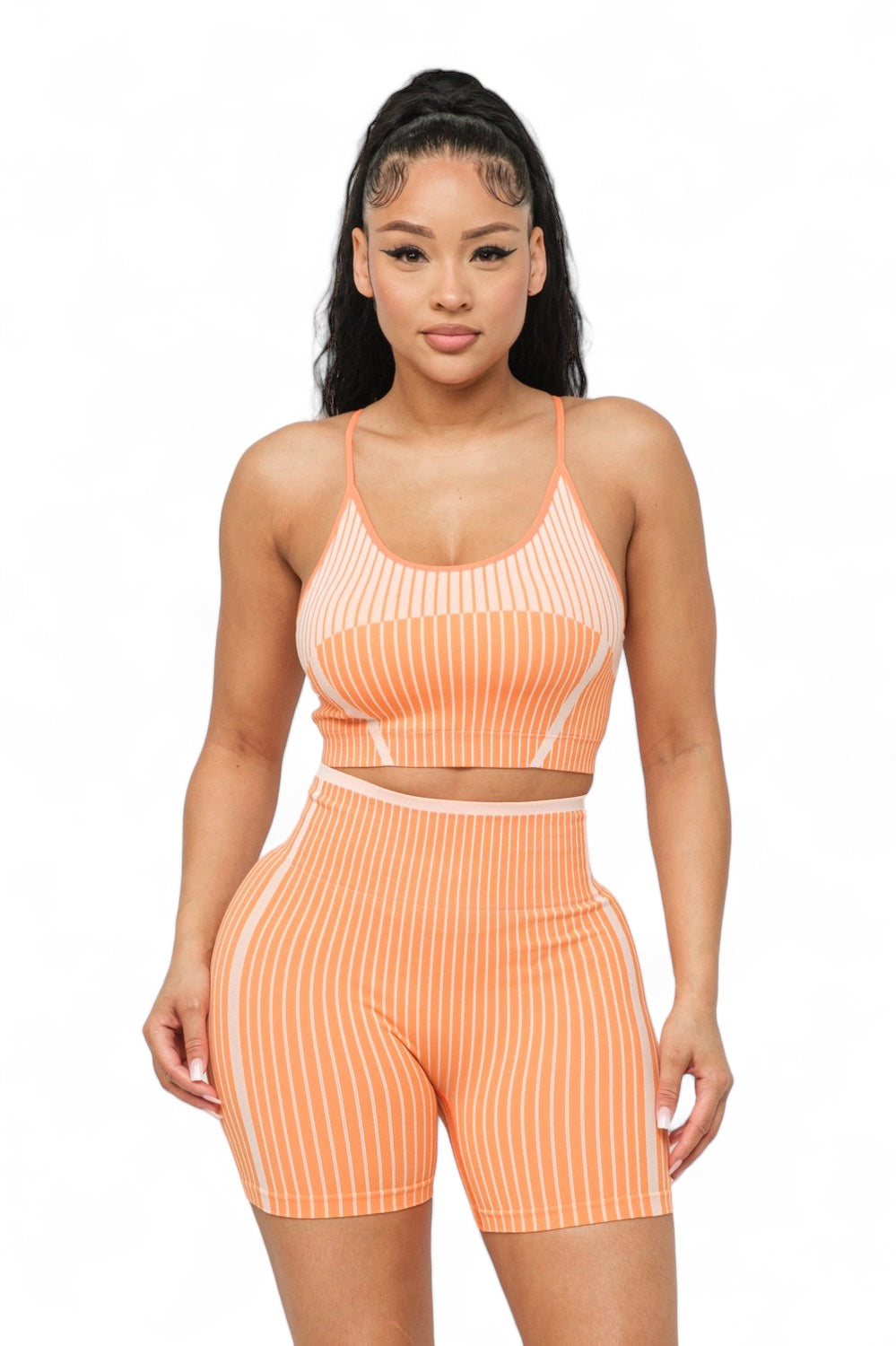 Seamless striped activewear set by The House of Stylez featuring a crop top and biker shorts in matching pattern.