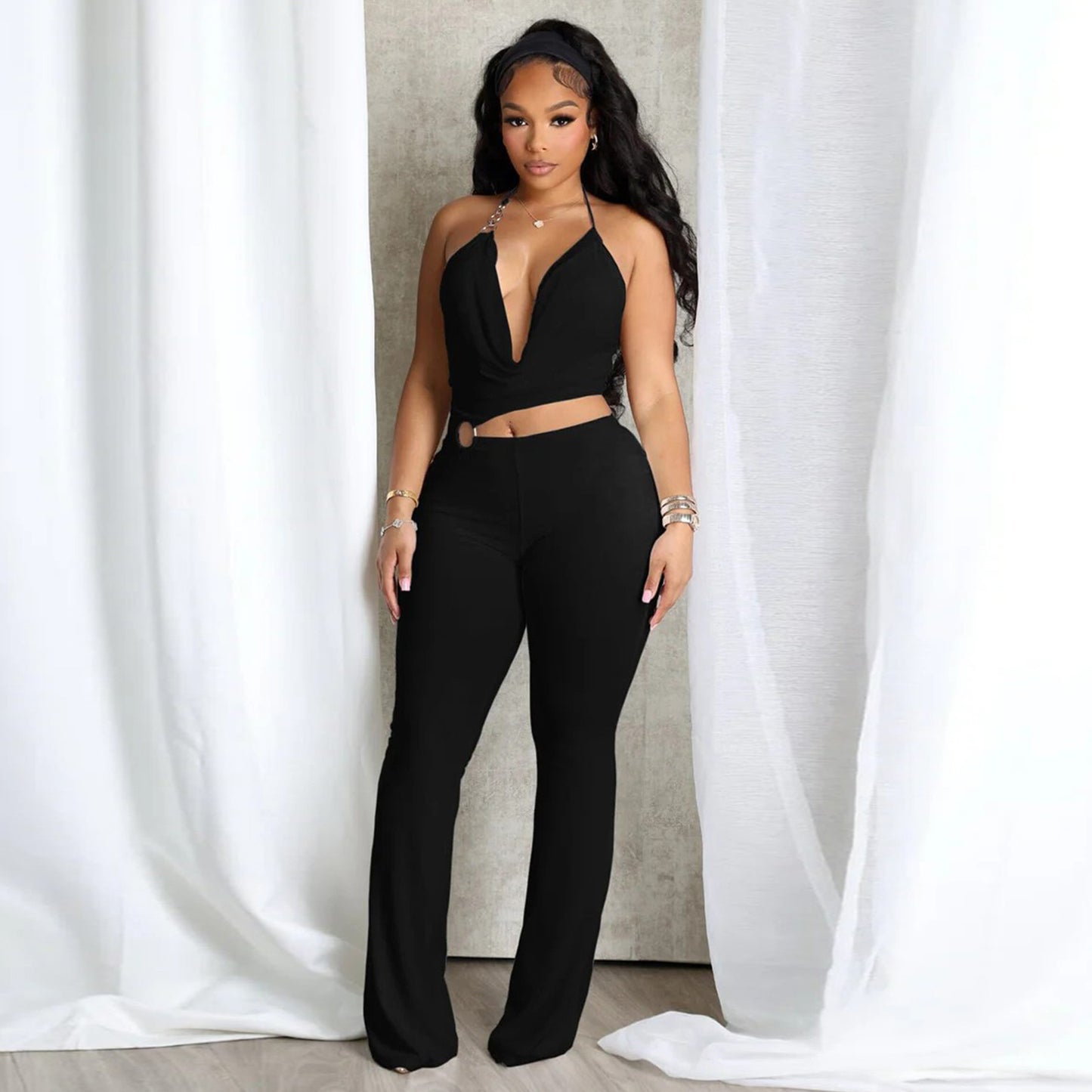 Plush Fashion Hub sleek halter neck jumpsuit with cut-out waist, stylish and fitted for a modern look.
