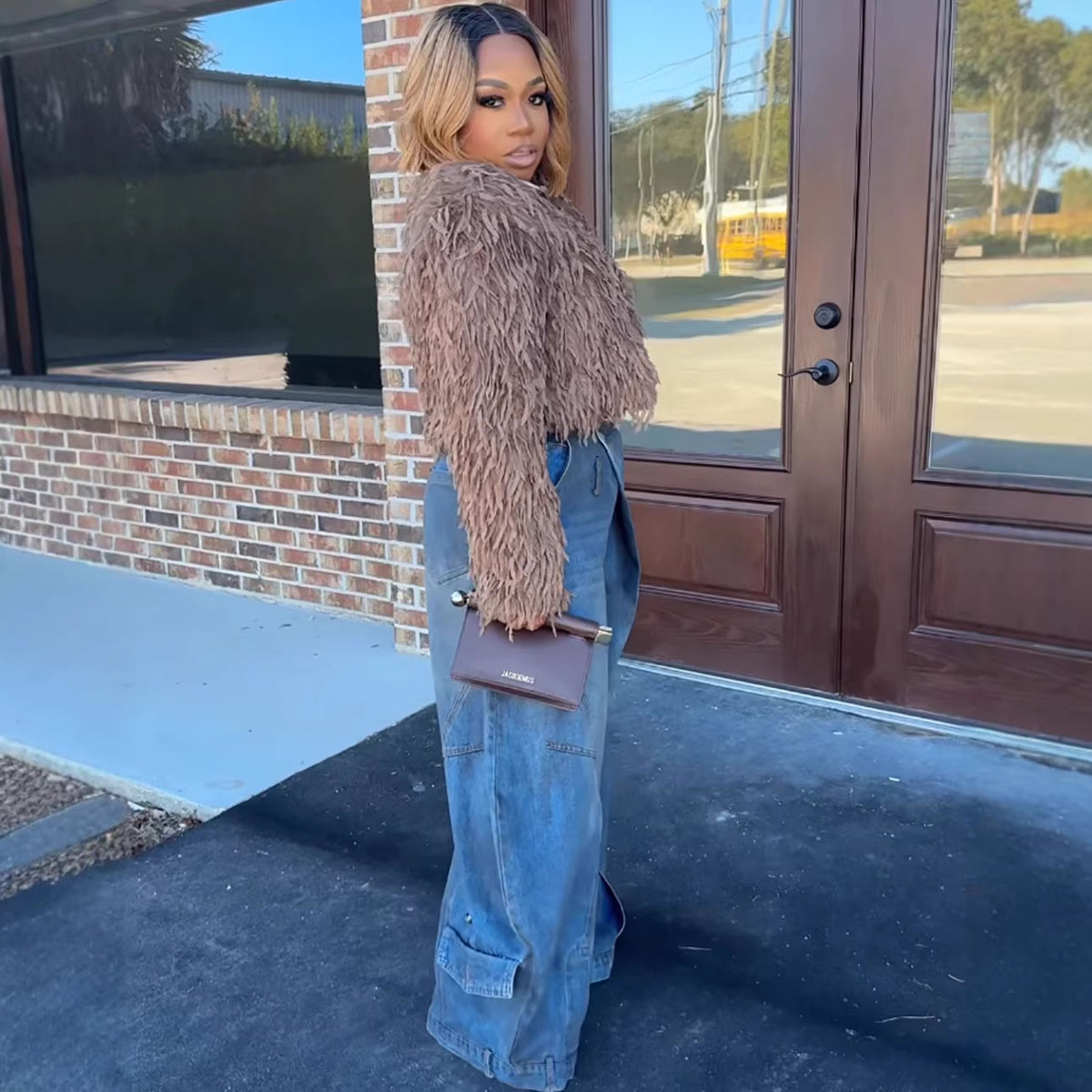 Women's vintage distressed washed wide-leg denim jeans by Plush Fashion Hub, showing the relaxed fit and distressed details.