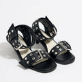 Eprolo rivet accent mid-heel strappy sandals showing tan leather straps with decorative rivets and a sturdy mid-height heel