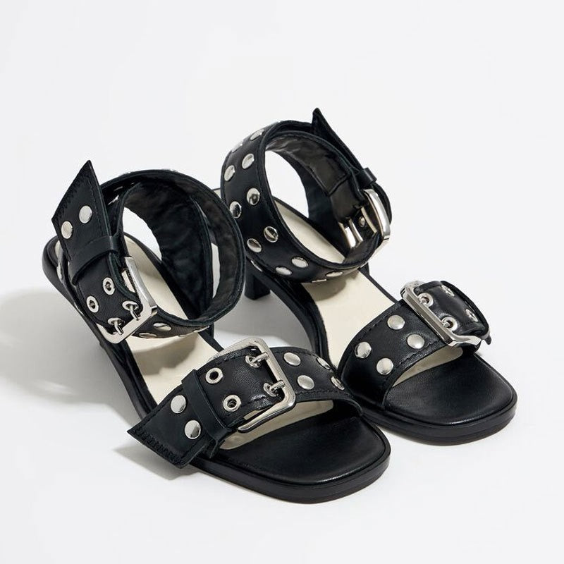 Eprolo rivet accent mid-heel strappy sandals showing tan leather straps with decorative rivets and a sturdy mid-height heel