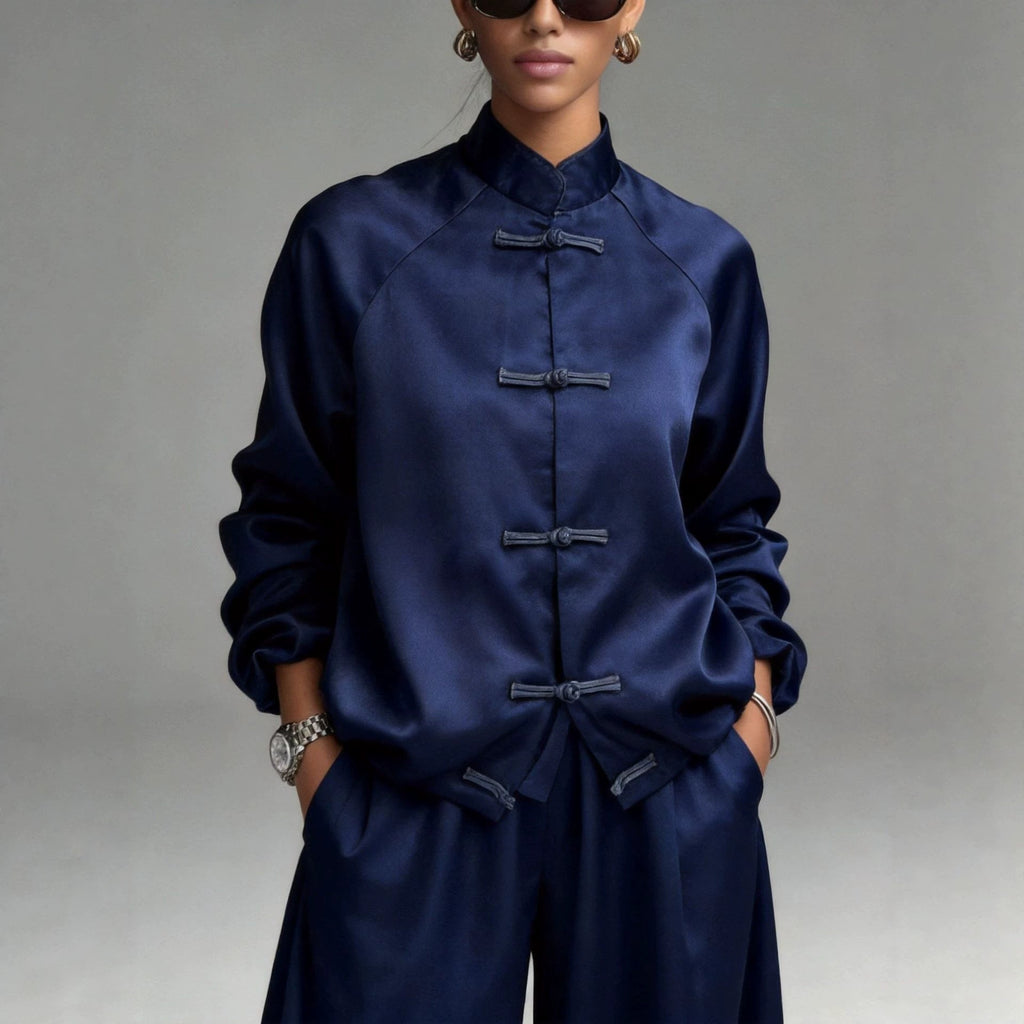 Women's satin two-piece set featuring a frog button jacket and wide-leg pants from Plush Fashion Hub, stylish and comfortable.