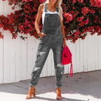 Women's ripped denim overalls by Plush Fashion Hub featuring a cropped style, streetwear strap bib design, and distressed details.