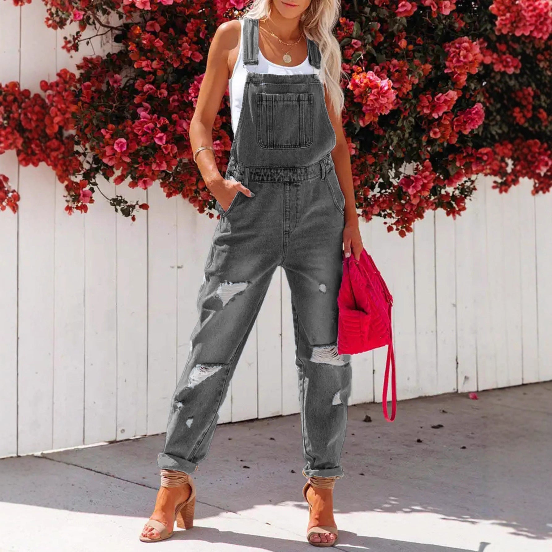 Women's ripped denim overalls by Plush Fashion Hub featuring a cropped style, streetwear strap bib design, and distressed details.