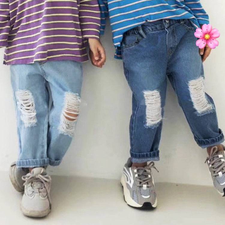Two children wearing distressed denim jeans, one light wash and one medium blue, paired with striped shirts.