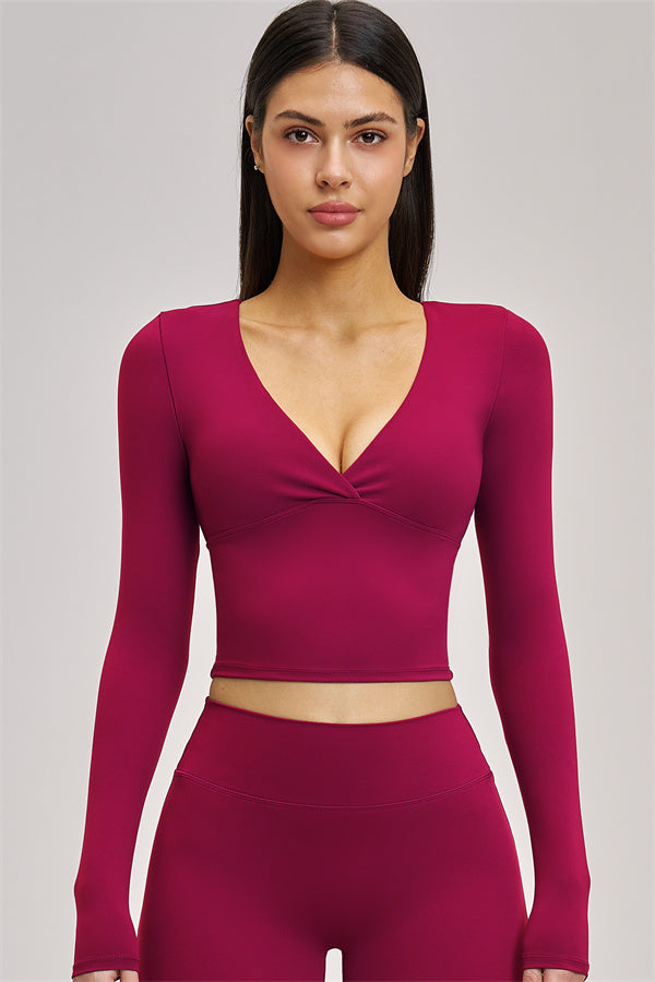Long sleeve crop top from Plush Fashion Hub's The Swoon collection, featuring a fitted design and soft fabric.