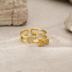 18K gold-plated bow open ring with delicate design, featuring a sleek, polished finish on a white background.