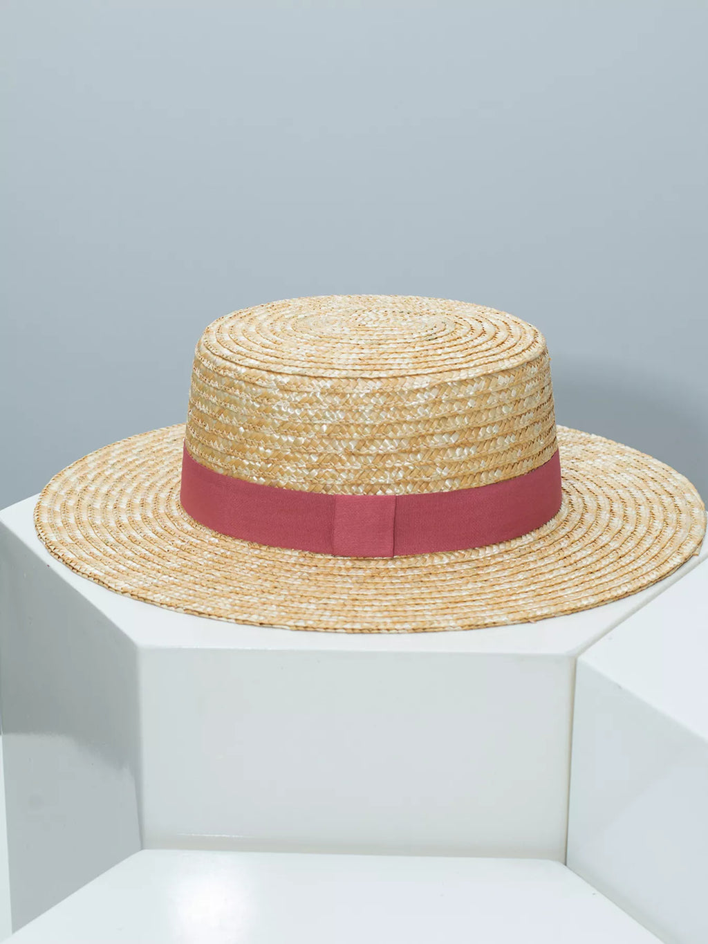 Elegant straw boater hat with decorative ribbon from Plush Fashion Hub, perfect for summer fashion and sun protection.