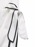 Black and white striped round neck sweatshirt from Trendsi, casual long-sleeve top with side stripe details.