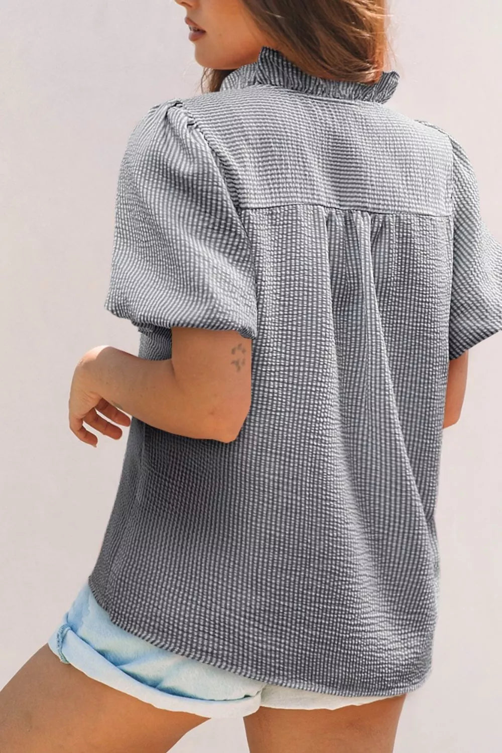 Striped ruffle short bubble sleeve shirt by Plush Fashion Hub featuring a stylish design with ruffles and short sleeves.