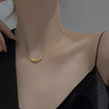 Sterling silver beaded necklace with evenly spaced round beads, crafted by Shopimist, close-up view of the jewelry.