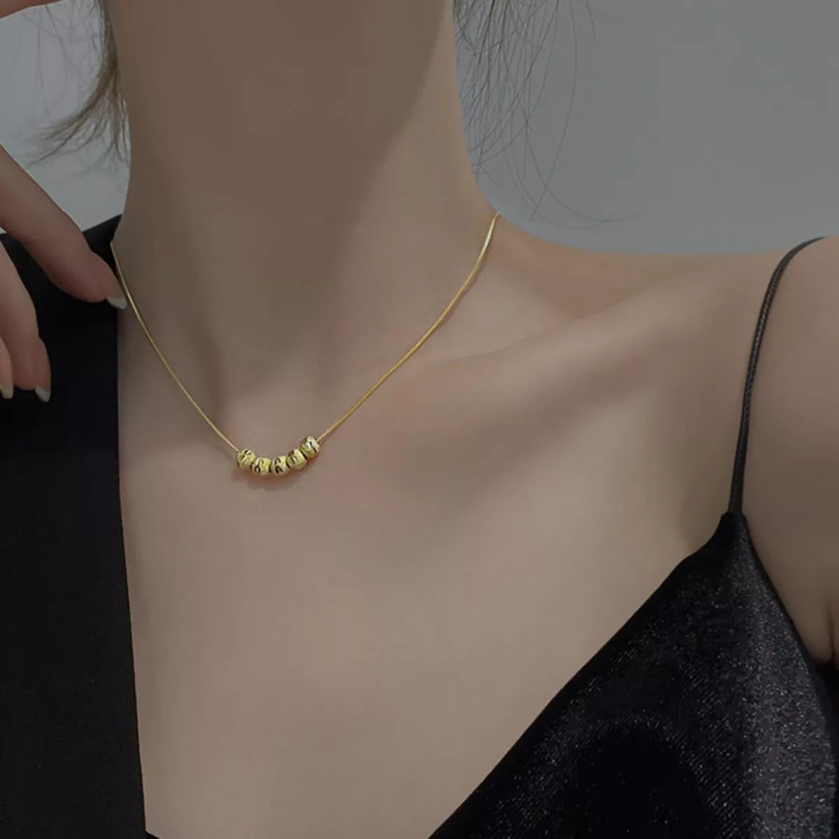 Sterling silver beaded necklace featuring evenly spaced beads, stylish jewelry piece from Plush Fashion Hub.