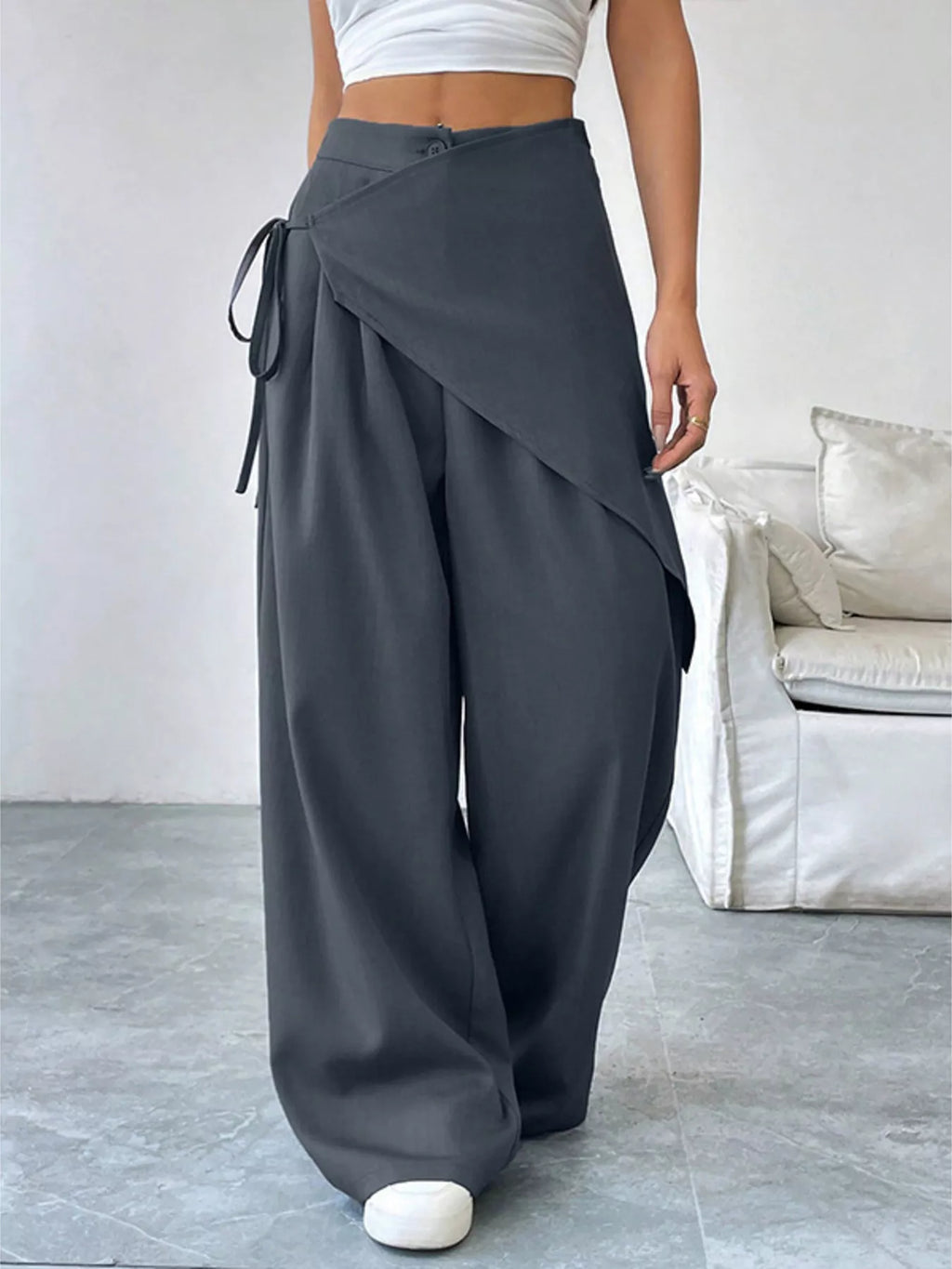 Asymmetrical wrap wide-leg pants from Plush Fashion Hub featuring a flowy, stylish design and a relaxed fit.