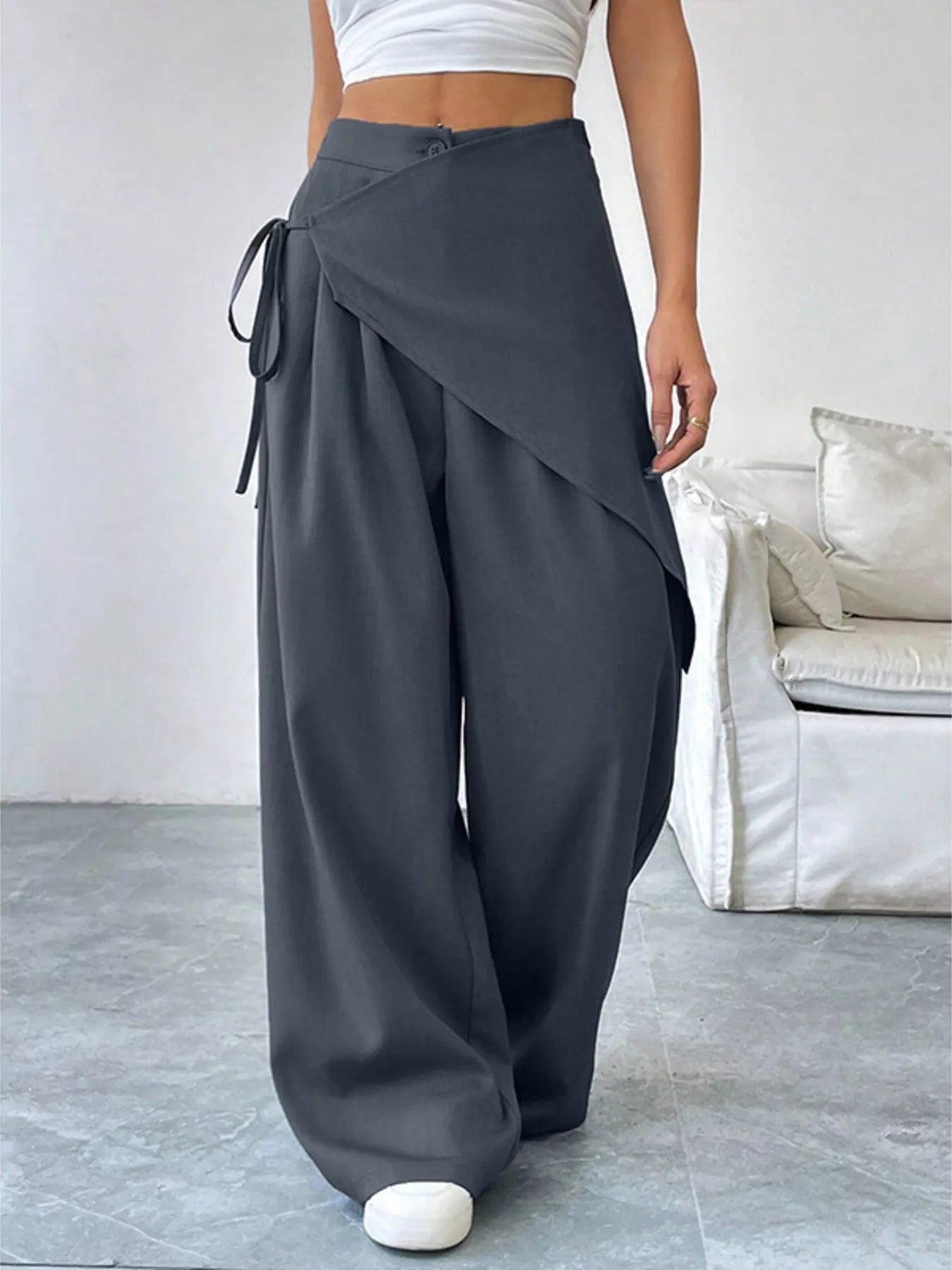 Asymmetrical wrap wide-leg pants from Plush Fashion Hub featuring a flowy, stylish design and a relaxed fit.