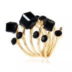 Multi-layered 18K gold-plated ring from Shopimist showcasing intricate design and shiny finish on a white background.