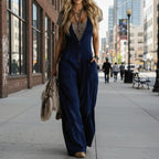 Light beige sleeveless wide-leg jumpsuit with two pockets from FitiqueFit, casual and comfortable for warm weather.