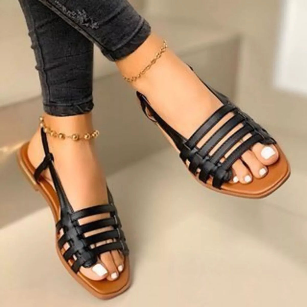 Open toe flats sandals by Shopimist featuring a sleek design with comfortable straps and a stylish minimalist look.