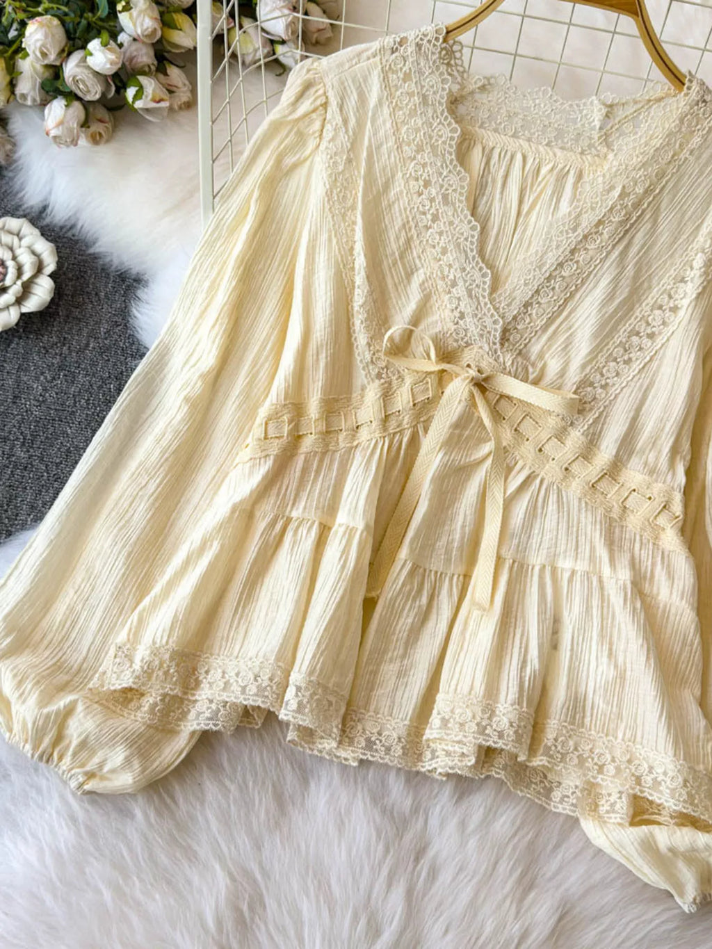 Lace detail V-neck blouse dress in soft fabric with delicate lace accents, stylish and feminine for versatile wear.
