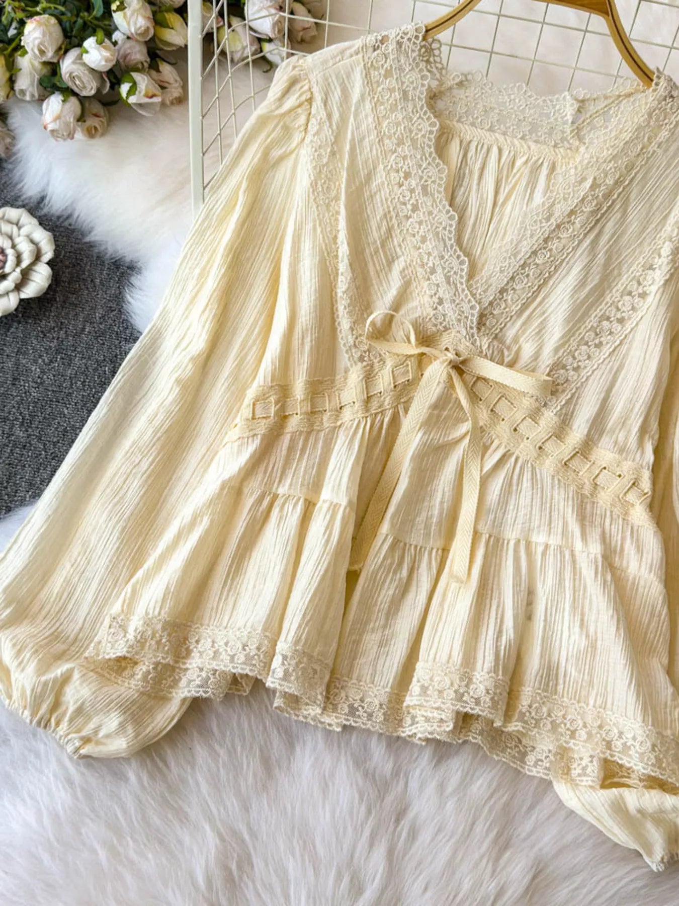 Lace detail V-neck blouse dress in soft fabric with delicate lace accents, stylish and feminine for versatile wear.