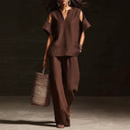 FitiqueFit V-neck short sleeve top and straight-leg pants two-piece set with ripped details and pockets in solid color.