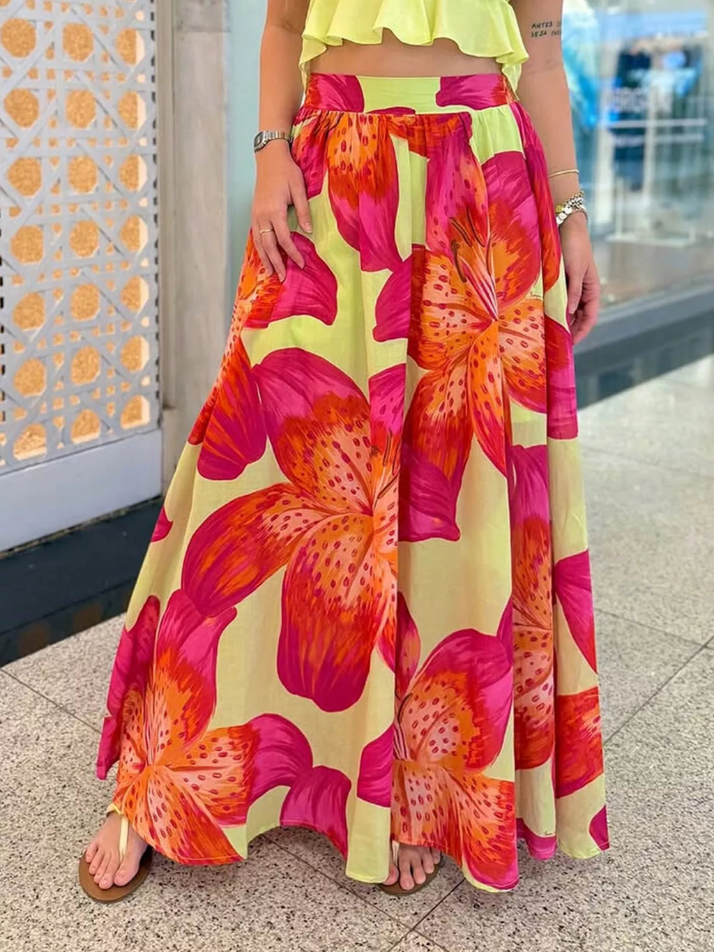 Women's floral print flowy maxi skirt with pockets, lightweight boho style from Trendsi, shown with a relaxed fit and vibrant floral pattern.