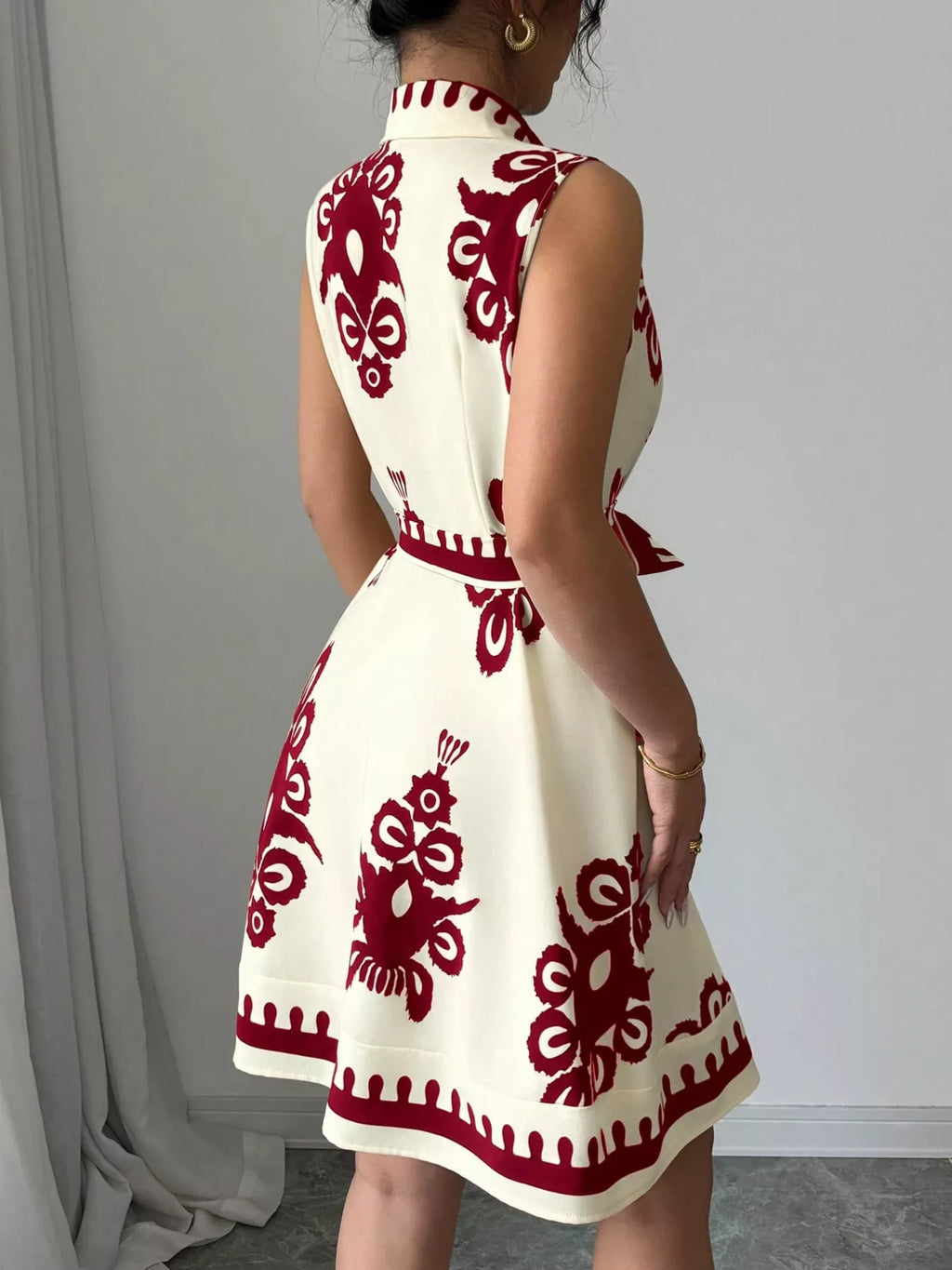 Sleeveless ruched printed tie waist dress by Shopimist, featuring a flattering fit and stylish design for casual or summer wear.