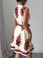 Sleeveless ruched printed tie waist dress by Shopimist, featuring a flattering fit and stylish design for casual or summer wear.