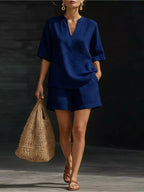 Plus size notched half sleeve top and shorts set by Trendsi, showing the matching stylish top and shorts in a full view.