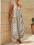 Polka dot V-neck sleeveless maxi dress by Shopimist, flowing fabric with a stylish polka dot pattern, perfect for summer wear.