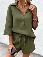 Women's short-sleeve notch-lapel top and belted shorts two-piece set by Plush Fashion Hub, displayed on a model.
