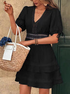 Lace detail V-neck mini dress by Shopimist featuring a fitted silhouette and elegant design, shown on a model.