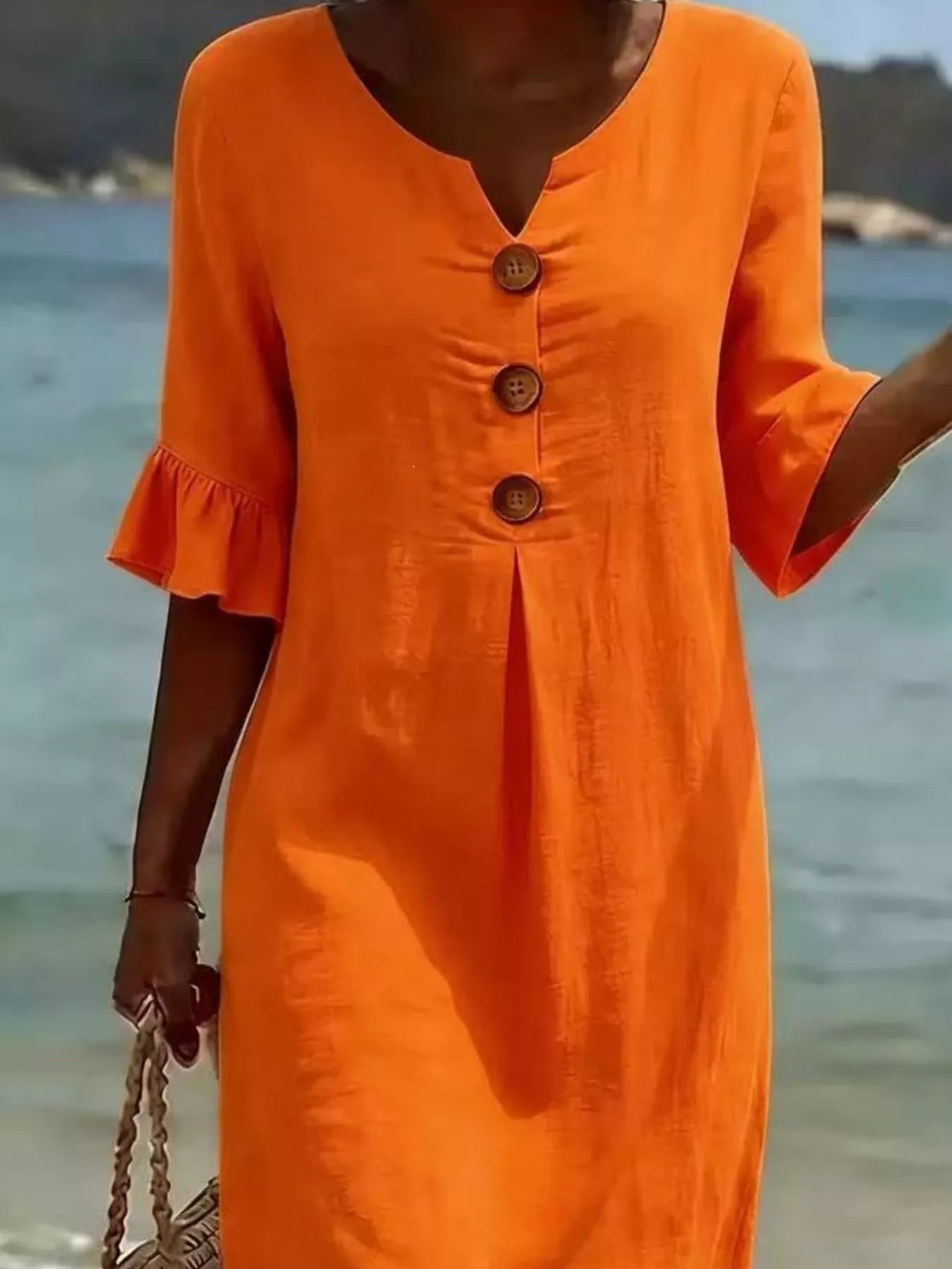 Plus size full-length midi dress with ruffle sleeves and button decor, featuring a stylish and comfortable design from Trendsi.
