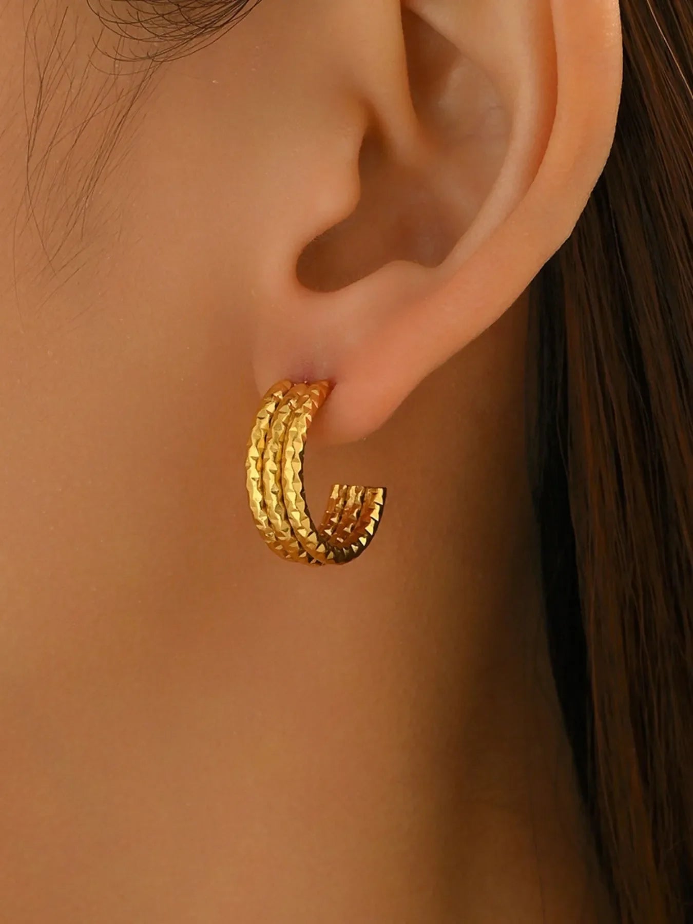 Gold-plated textured triple band hoop earrings from Plush Fashion Hub, showcasing layered, shiny hoop design.