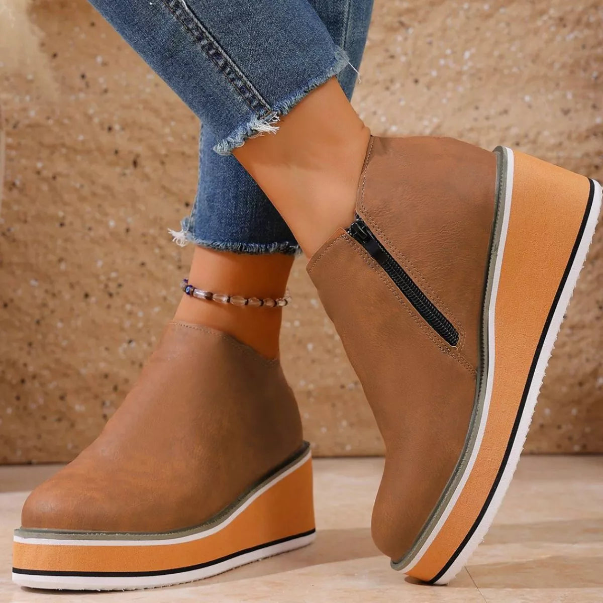 Women's round toe wedge ankle boots by Trendsi featuring a stylish design and ankle-high cut, perfect for casual or dressy outfits.