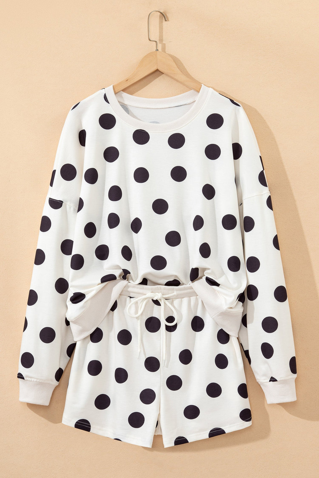 Marley shoulder pullover and drawstring shorts set by Threaded Pear, casual loungewear on a model.