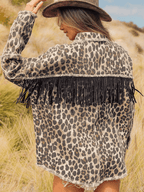 VYSN leopard fringe detail denim jacket with collared neck, featuring leopard print and fringe accents on the shoulders.