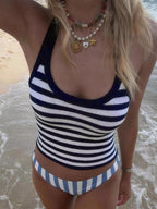 Striped halter neck cami top from Trendsi featuring a stylish design and adjustable straps, perfect for casual summer wear.