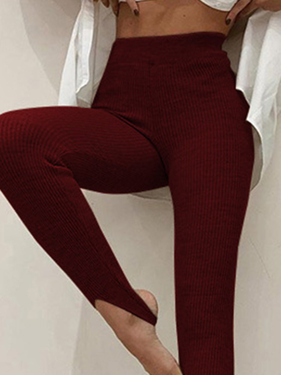 Plush Fashion Hub ribbed mid-waist leggings in black, showcasing their stretchy fabric and comfortable fit.