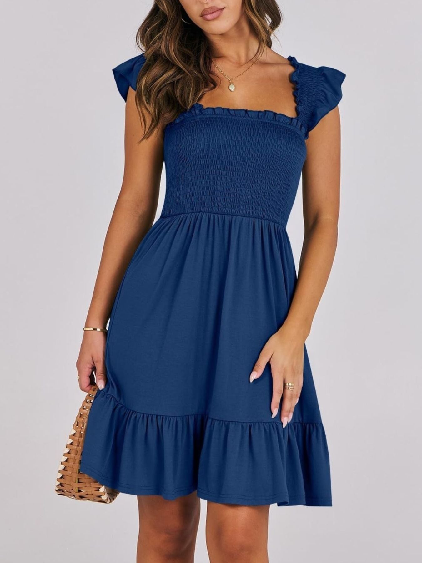 Women's smocked ruffle hem mini dress by Trendsi, lightweight casual summer dress with a relaxed fit and ruffled details.