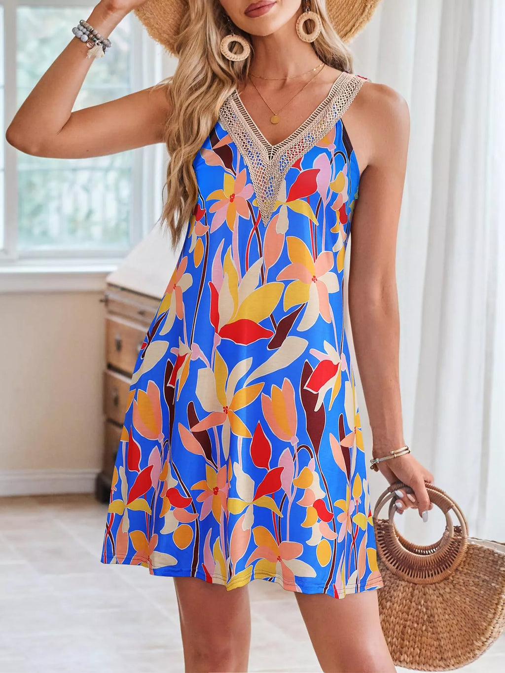 Tropical leaf print sleeveless V-neck dress by Shopimist, showing vibrant green and yellow foliage on lightweight fabric.