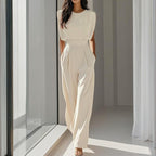 Women’s casual FitiqueFit wide-leg short sleeve jumpsuit with a relaxed fit and lightweight fabric, perfect for warm weather.